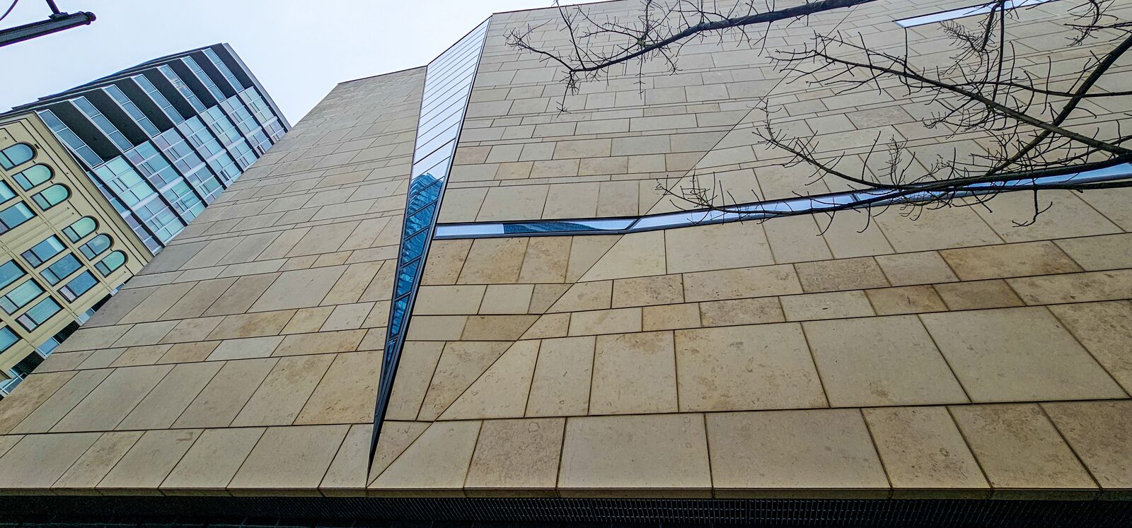Limestone facade detail with slot glazing